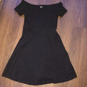 Black off the shoulder dress.